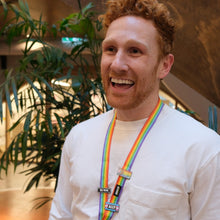 Load image into Gallery viewer, rainbow lanyard with trans ally pin and enamel pronoun pin