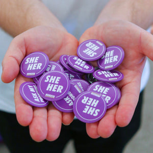 purple pronoun badges she / her